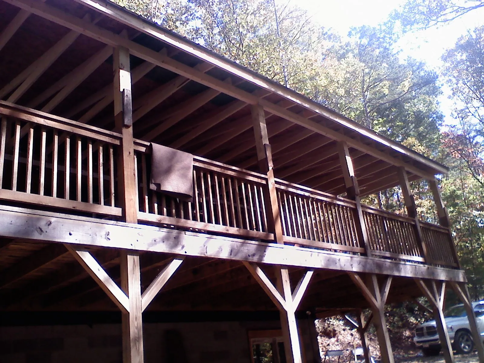 Timber framing under a new elevated porch and deck — Roof Leak Repair in Long Branch by Roofing Brothers